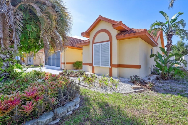 6415 39th Ave W, Bradenton, FL 34209 - exterior space with a tile roof and stucco siding