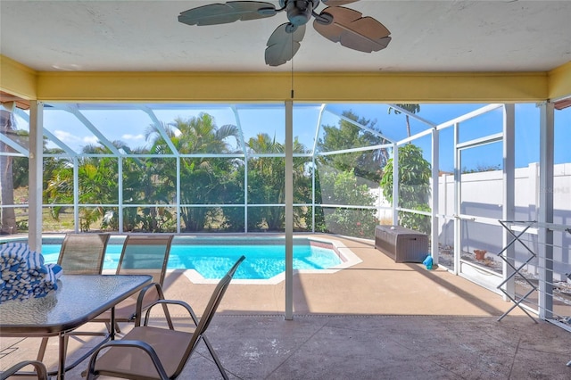 6415 39th Ave W, Bradenton, FL 34209 - outdoor pool featuring a ceiling fan, glass enclosure, and a patio area