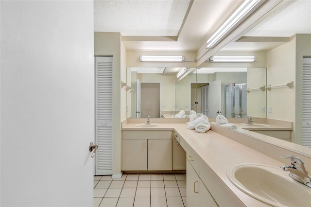 6415 39th Ave W, Bradenton, FL 34209 - full bathroom with a closet, a sink, tile patterned flooring, and double vanity