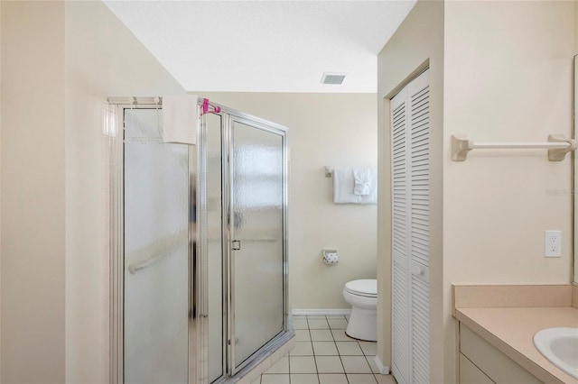 6415 39th Ave W, Bradenton, FL 34209 - full bathroom featuring a shower stall, vanity, baseboards, tile patterned floors, and a closet