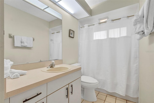 6415 39th Ave W, Bradenton, FL 34209 - bathroom with toilet, tile patterned floors, and vanity