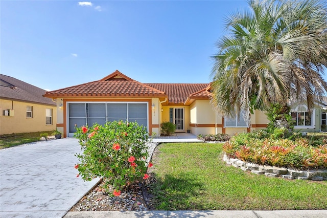 6415 39th Ave W, Bradenton, FL 34209 - view of front of property with a front yard, stucco siding, an attached garage, driveway, and a tile roof