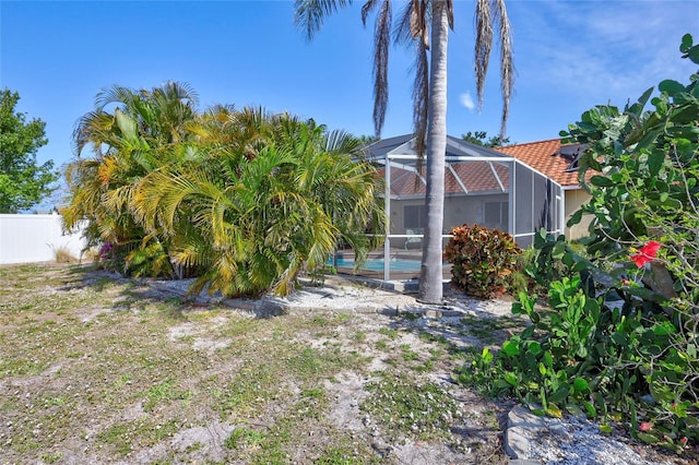 6415 39th Ave W, Bradenton, FL 34209 - view of yard with a lanai, an outdoor pool, and fence