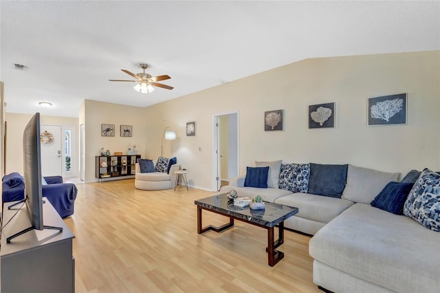 6415 39th Ave W, Bradenton, FL 34209 - living room featuring baseboards, a ceiling fan, light wood-style flooring, and visible vents