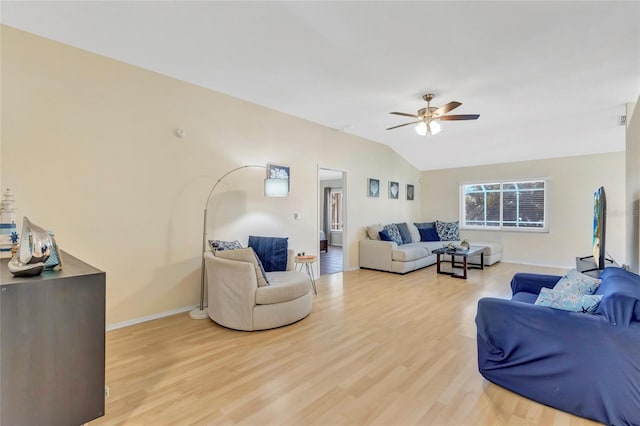 6415 39th Ave W, Bradenton, FL 34209 - living room with ceiling fan, lofted ceiling, baseboards, and light wood finished floors