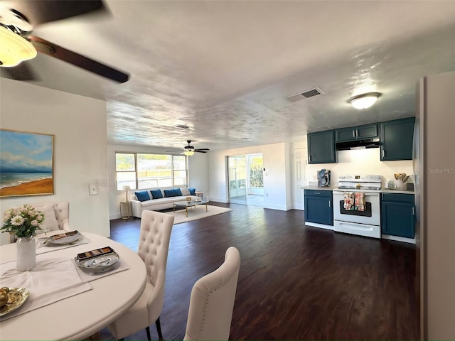 9430 Glen Moor Ln, Port Richey, FL 34668 - kitchen with white appliances, a ceiling fan, dark wood-type flooring, open floor plan, and blue cabinetry
