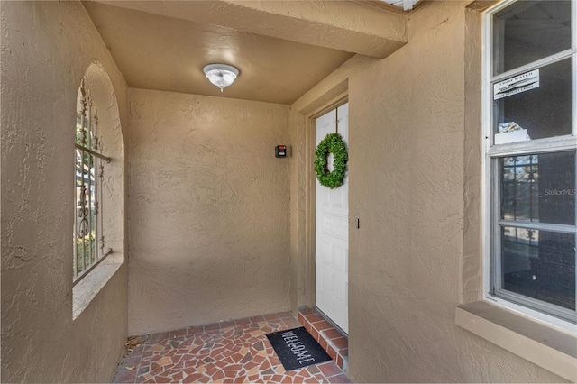 9430 Glen Moor Ln, Port Richey, FL 34668 - entrance to property featuring stucco siding