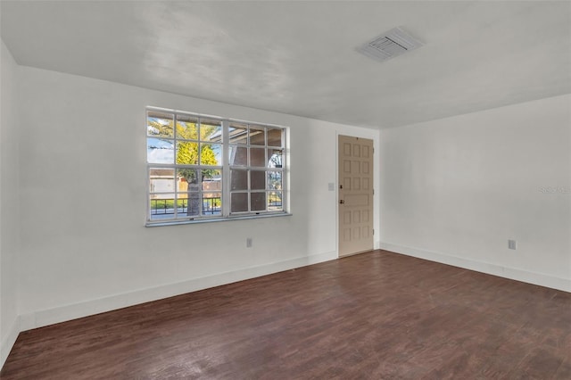 9430 Glen Moor Ln, Port Richey, FL 34668 - unfurnished room with wood finished floors and baseboards