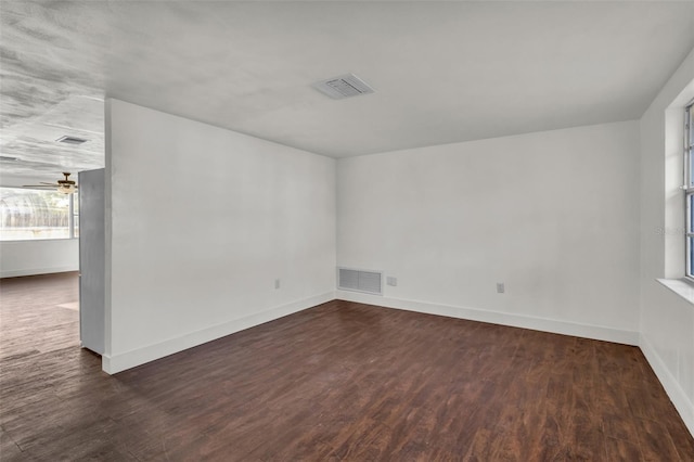 9430 Glen Moor Ln, Port Richey, FL 34668 - unfurnished room featuring wood finished floors, baseboards, and ceiling fan