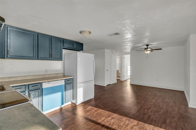 9430 Glen Moor Ln, Port Richey, FL 34668 - kitchen with freestanding refrigerator, dishwashing machine, blue cabinetry, a ceiling fan, and dark wood-style floors