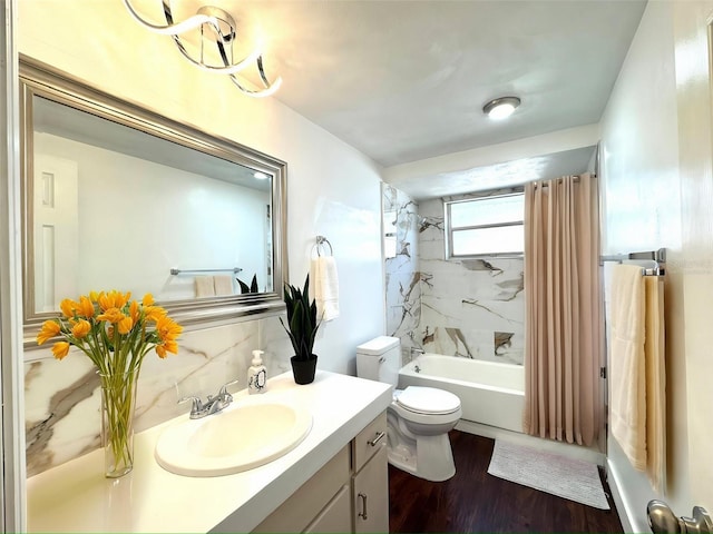 9430 Glen Moor Ln, Port Richey, FL 34668 - bathroom featuring vanity, toilet, shower / bath combination with curtain, and wood finished floors