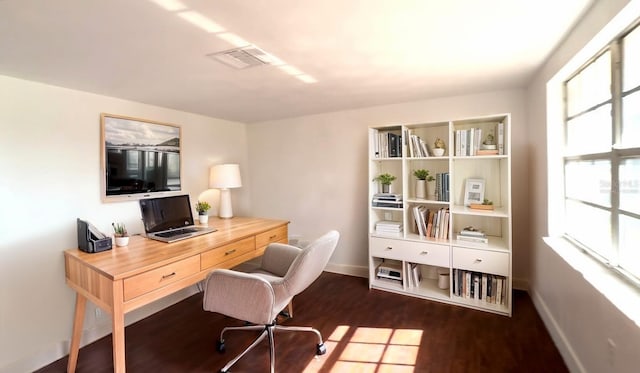 9430 Glen Moor Ln, Port Richey, FL 34668 - office area featuring baseboards, wood finished floors, and healthy amount of natural light