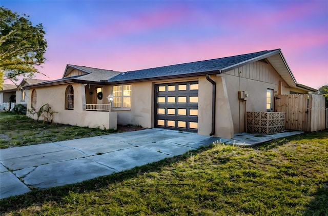 9430 Glen Moor Ln, Port Richey, FL 34668 - single story home with a garage, stucco siding, and driveway