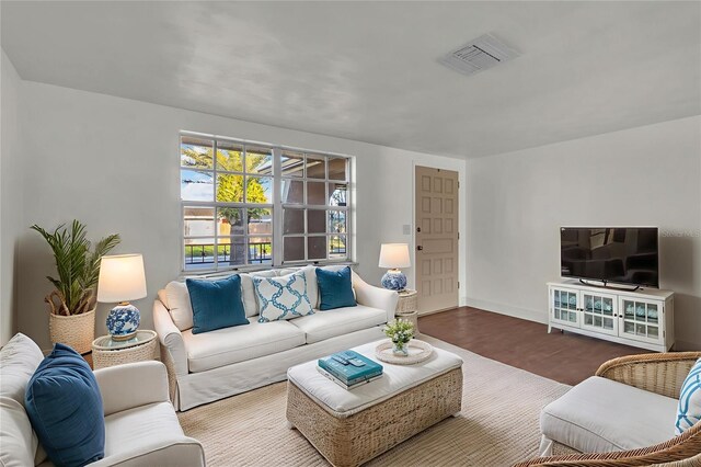 9430 Glen Moor Ln, Port Richey, FL 34668 - living area featuring wood finished floors and baseboards