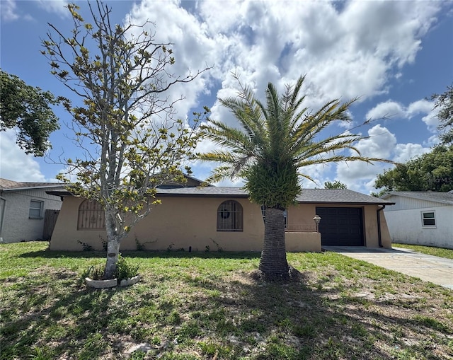 9430 Glen Moor Ln, Port Richey, FL 34668 - view of front of property featuring concrete driveway, stucco siding, and an attached garage