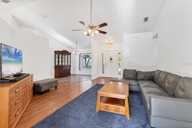 living area with lofted ceiling, visible vents, light wood-type flooring, and ceiling fan