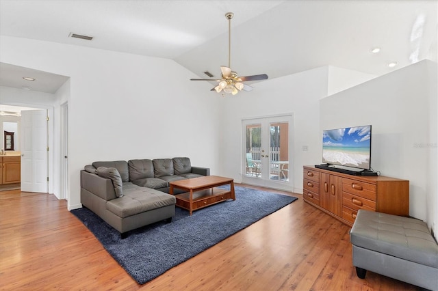 living area with recessed lighting, ceiling fan, light wood-type flooring, visible vents, and vaulted ceiling