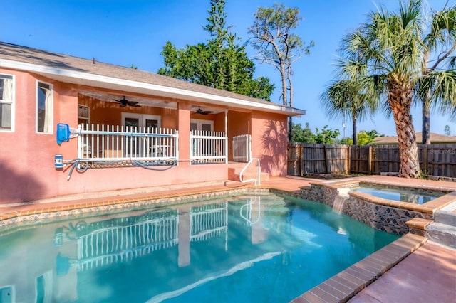 view of pool with a patio, a fenced in pool, ceiling fan, an in ground hot tub, and fence