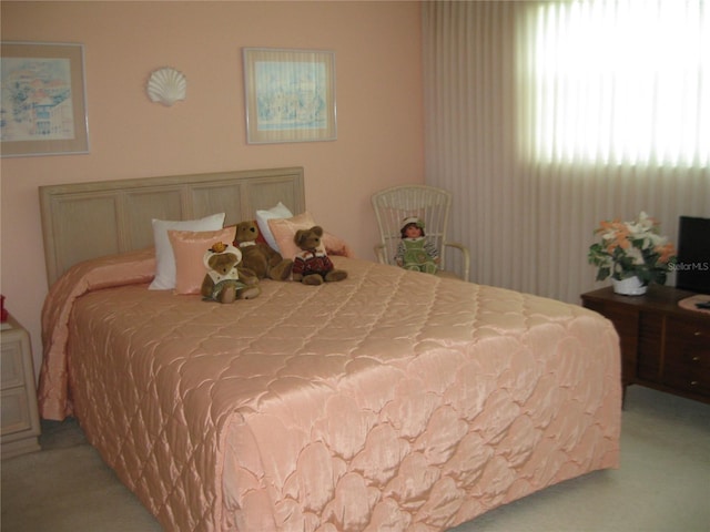 bedroom with light colored carpet