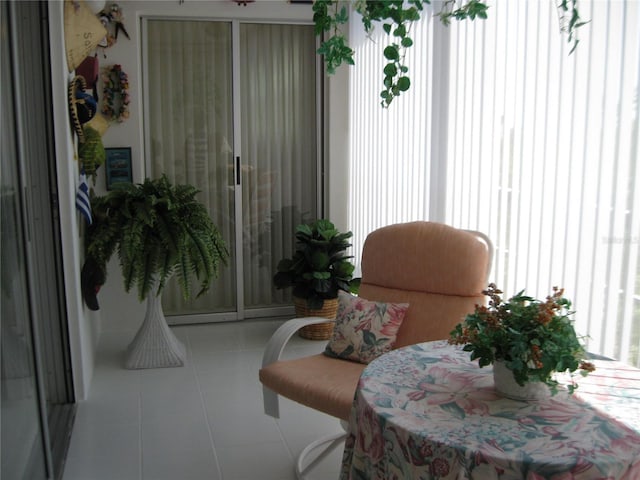 living area with tile patterned floors