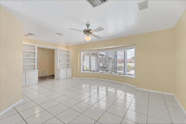 4405 Harbor Blvd, Port Charlotte, FL 33952 - spare room with baseboards, ceiling fan, and light tile patterned flooring