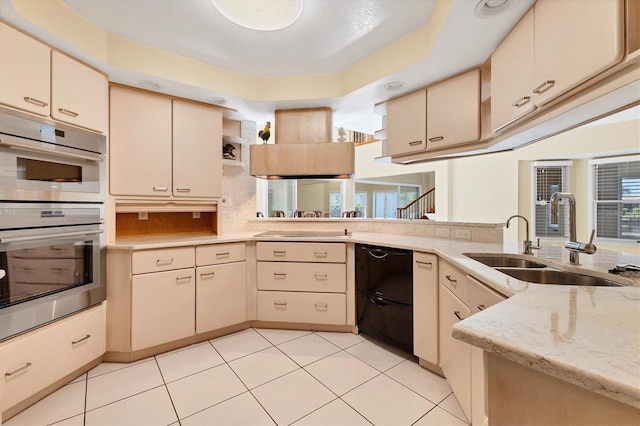 4405 Harbor Blvd, Port Charlotte, FL 33952 - kitchen featuring dishwasher, a sink, double oven, cream cabinetry, and backsplash