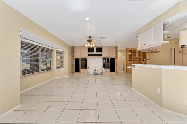 4405 Harbor Blvd, Port Charlotte, FL 33952 - unfurnished living room featuring ceiling fan, baseboards, light tile patterned flooring, a sink, and recessed lighting