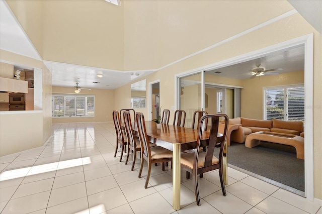 4405 Harbor Blvd, Port Charlotte, FL 33952 - dining area with a ceiling fan, plenty of natural light, light tile patterned floors, and a high ceiling