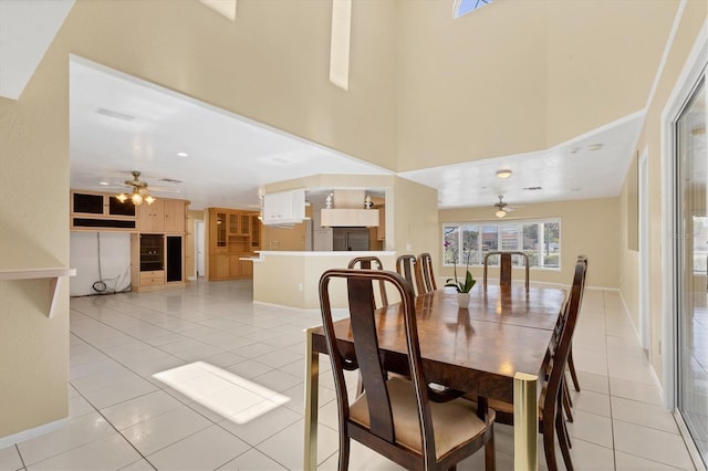 4405 Harbor Blvd, Port Charlotte, FL 33952 - dining area featuring a ceiling fan, light tile patterned floors, baseboards, and a towering ceiling