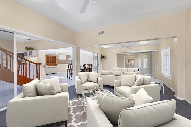 4405 Harbor Blvd, Port Charlotte, FL 33952 - living room with a ceiling fan, stairs, baseboards, and carpet flooring