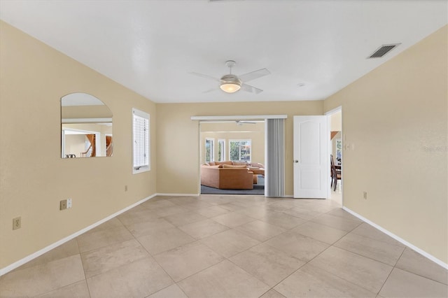 4405 Harbor Blvd, Port Charlotte, FL 33952 - unfurnished room featuring a ceiling fan, light tile patterned floors, and baseboards
