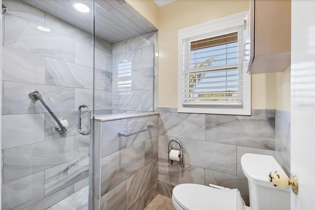 4405 Harbor Blvd, Port Charlotte, FL 33952 - full bath featuring toilet, a stall shower, tile walls, and wainscoting
