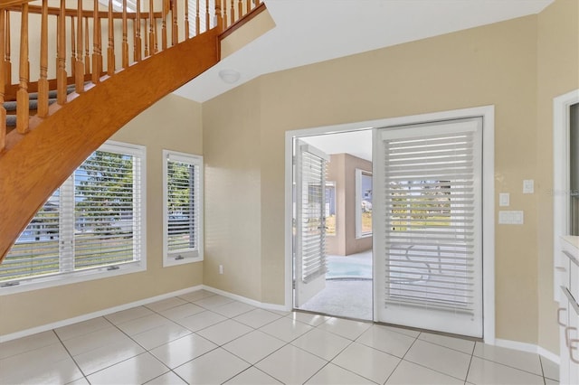 4405 Harbor Blvd, Port Charlotte, FL 33952 - unfurnished room featuring baseboards, light tile patterned floors, and stairway