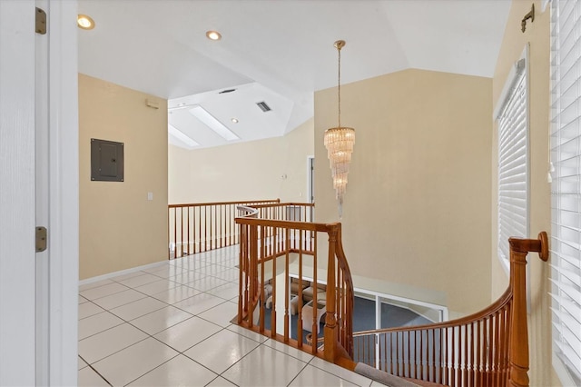 4405 Harbor Blvd, Port Charlotte, FL 33952 - corridor featuring an upstairs landing, a chandelier, vaulted ceiling, electric panel, and tile patterned flooring