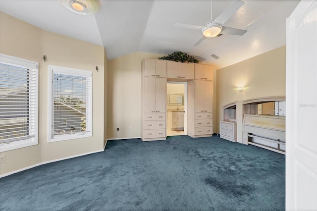 4405 Harbor Blvd, Port Charlotte, FL 33952 - unfurnished bedroom with lofted ceiling, dark carpet, connected bathroom, ceiling fan, and baseboards