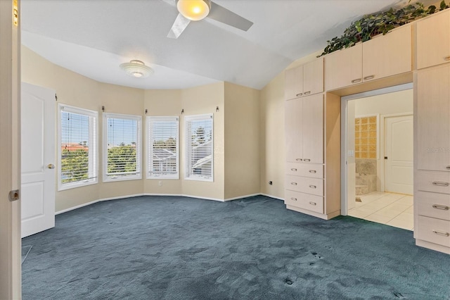 4405 Harbor Blvd, Port Charlotte, FL 33952 - unfurnished bedroom featuring dark colored carpet, vaulted ceiling, baseboards, and ceiling fan