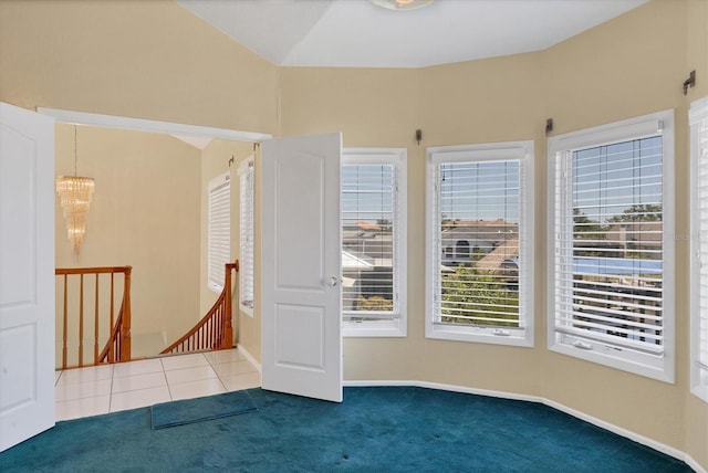 4405 Harbor Blvd, Port Charlotte, FL 33952 - carpeted empty room featuring healthy amount of natural light and a chandelier