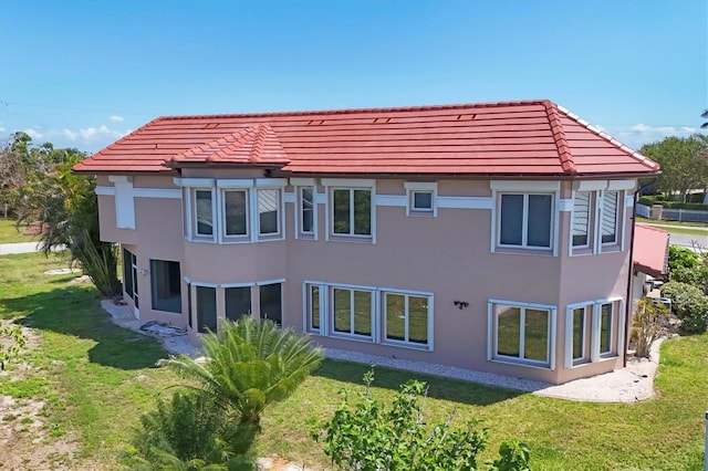 4405 Harbor Blvd, Port Charlotte, FL 33952 - rear view of house featuring a yard and stucco siding
