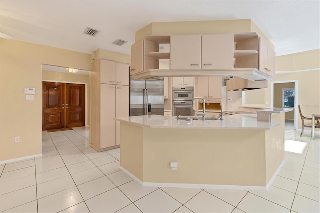 4405 Harbor Blvd, Port Charlotte, FL 33952 - kitchen with open shelves, appliances with stainless steel finishes, a sink, and a peninsula