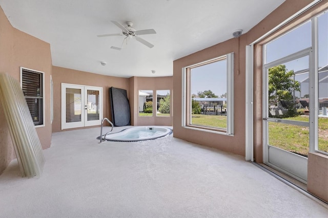 4405 Harbor Blvd, Port Charlotte, FL 33952 - unfurnished sunroom with a ceiling fan, french doors, and healthy amount of natural light