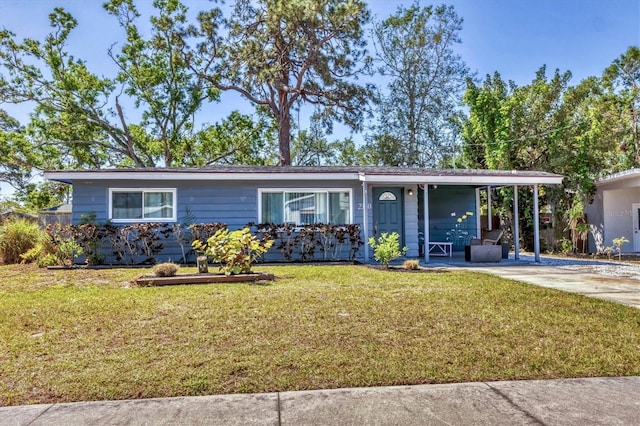 single story home featuring a front lawn and driveway