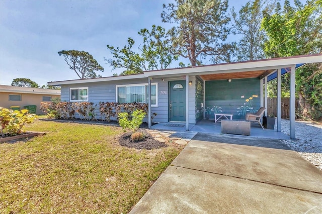 ranch-style house with fence and a front yard