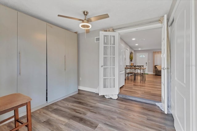 interior space featuring recessed lighting, wood finished floors, visible vents, french doors, and ceiling fan