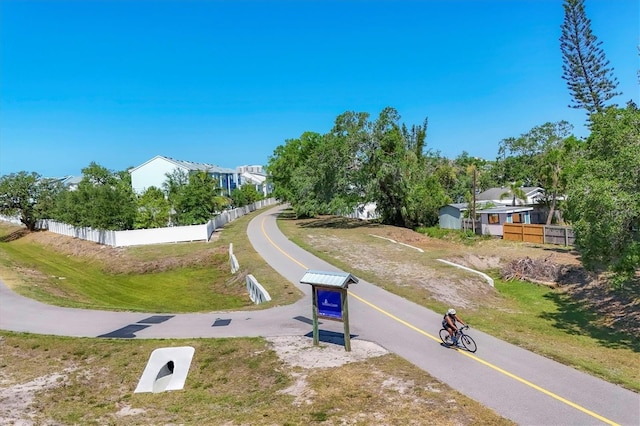 view of community featuring fence