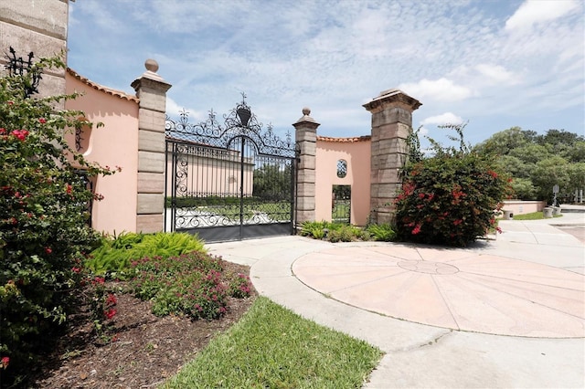 view of gate with fence