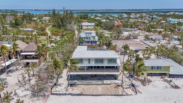 birds eye view of property featuring a water view and a residential view