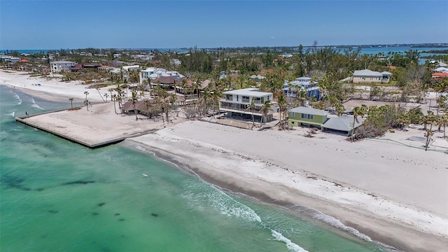 aerial view with a view of the beach and a water view