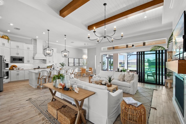11611 Roseto Ct, Fort Myers, FL 33913 - living area with a chandelier, beamed ceiling, light wood-type flooring, and recessed lighting