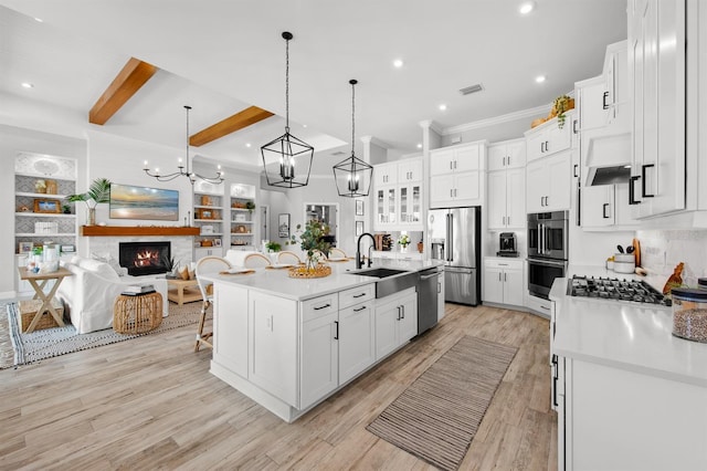 11611 Roseto Ct, Fort Myers, FL 33913 - kitchen with appliances with stainless steel finishes, a sink, open floor plan, white cabinets, and recessed lighting