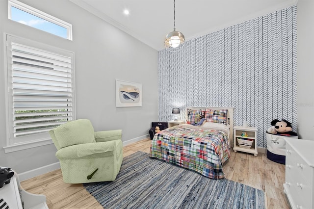 11611 Roseto Ct, Fort Myers, FL 33913 - bedroom with an accent wall, baseboards, wood finished floors, and a high ceiling